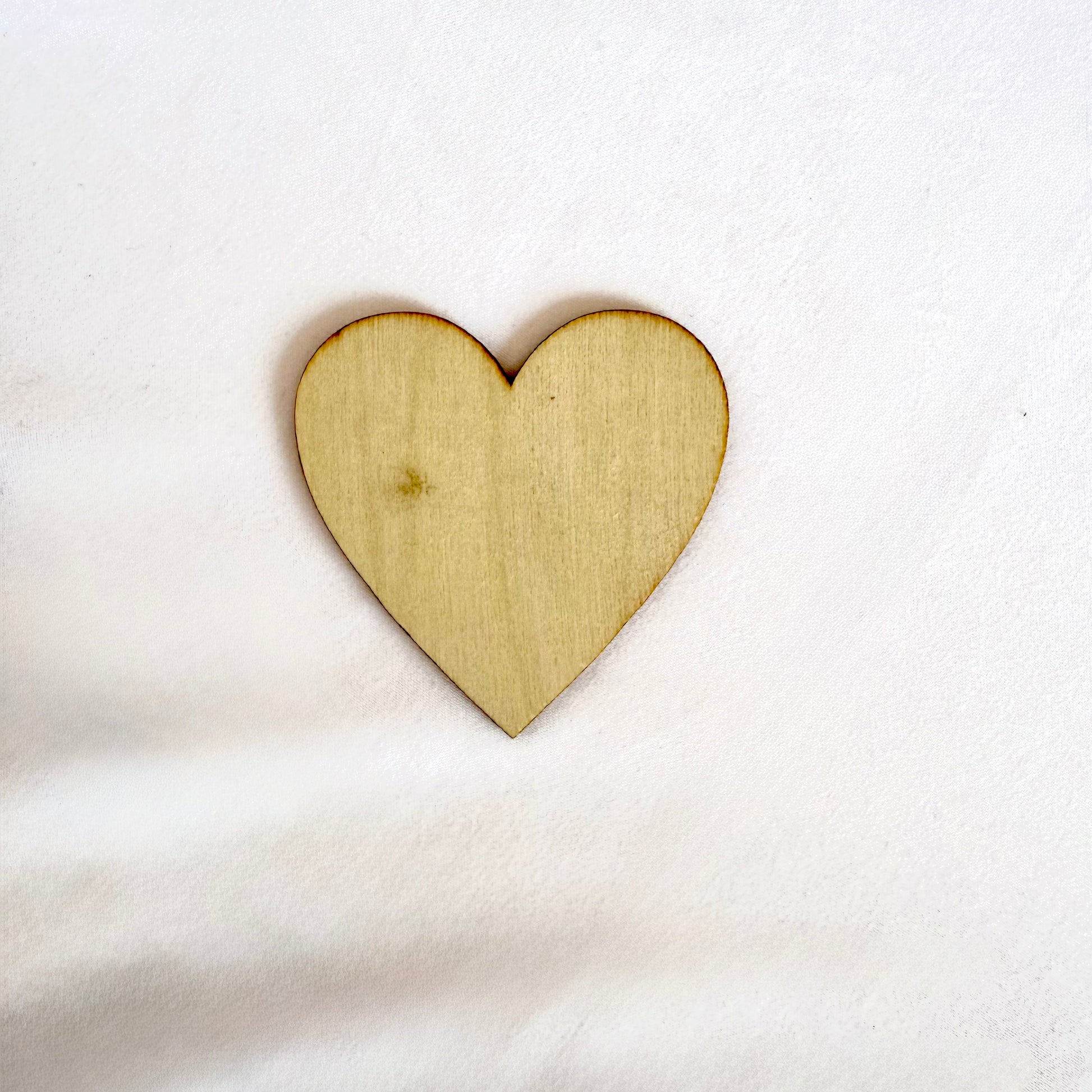 Wooden heart shape on a white background